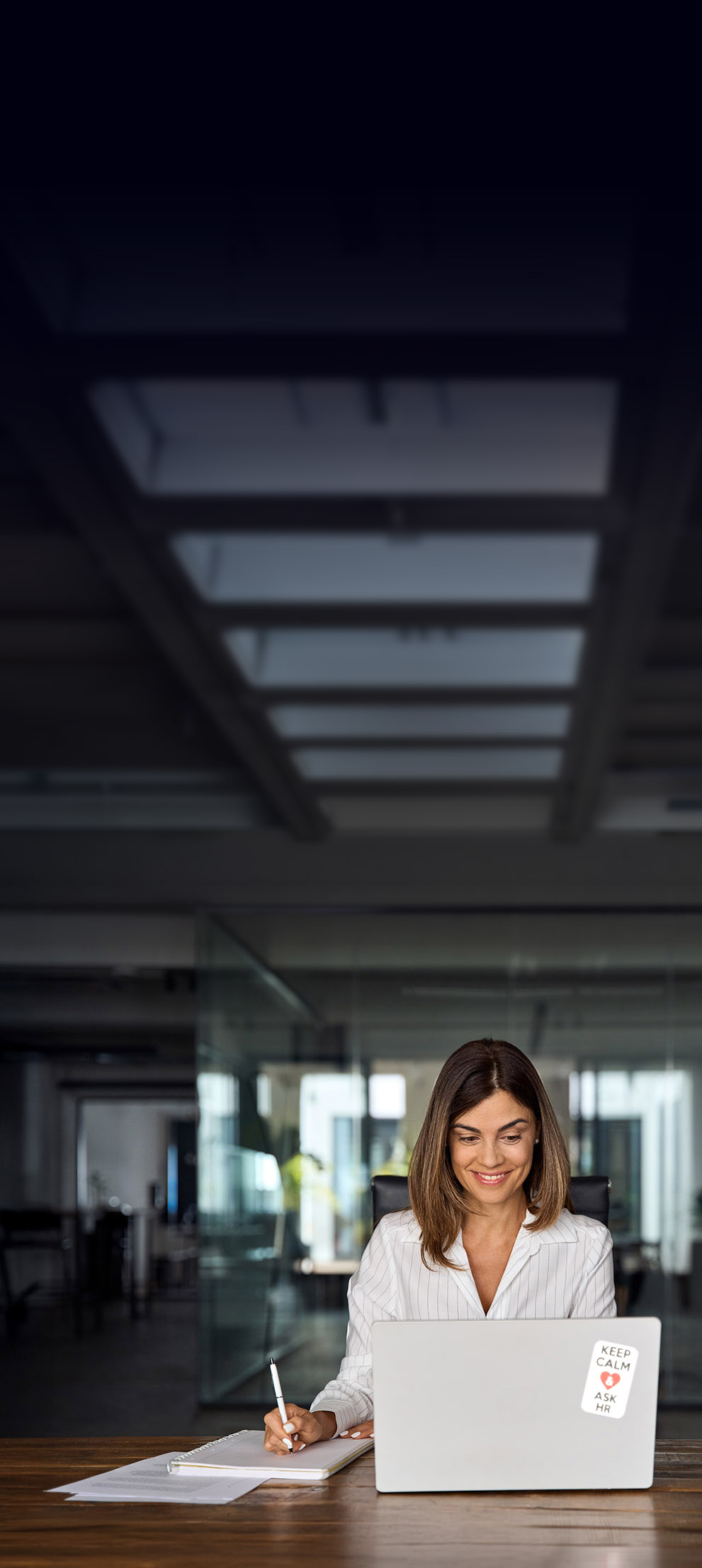 Professional woman is using online training after hours for course certification to maintain compliance, proficiency and career advancement.